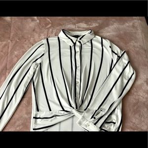 Black and white striped blouse. Long sleeve.